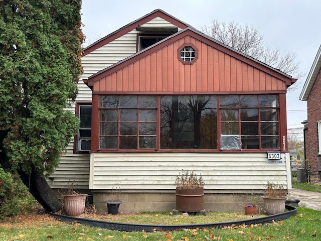 view of side of property with central AC unit