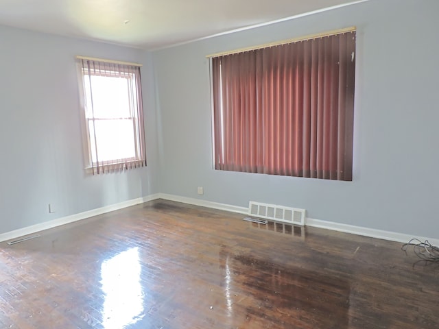 empty room featuring hardwood / wood-style flooring