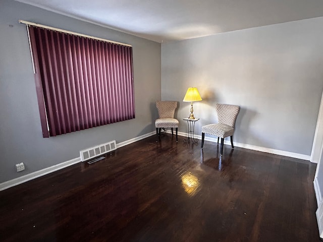 sitting room with dark hardwood / wood-style flooring