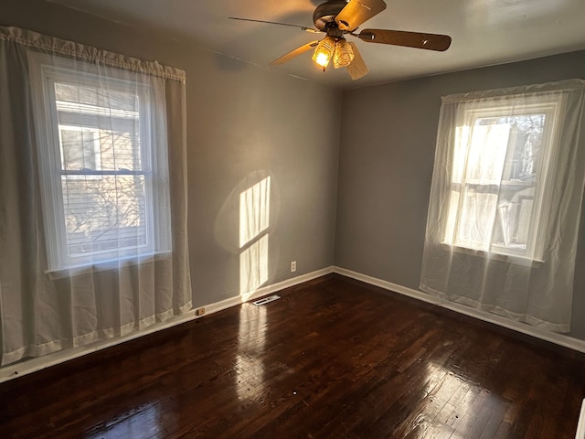 empty room featuring ceiling fan and wood-type flooring