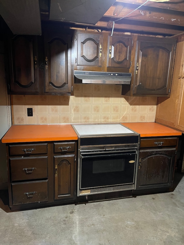 kitchen featuring electric range and dark brown cabinetry