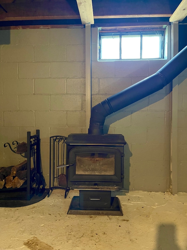 details featuring concrete flooring and a wood stove