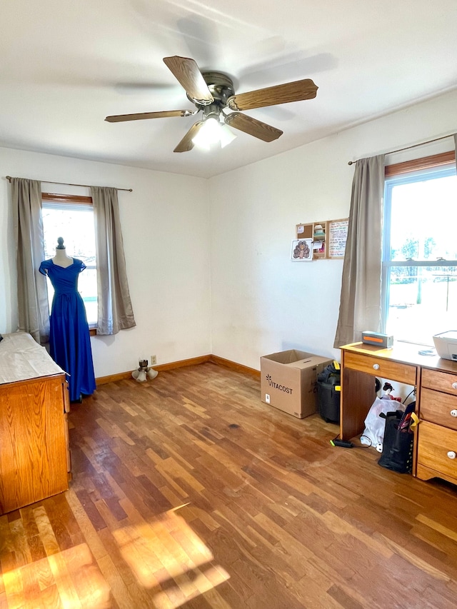 interior space featuring dark hardwood / wood-style flooring, plenty of natural light, and ceiling fan