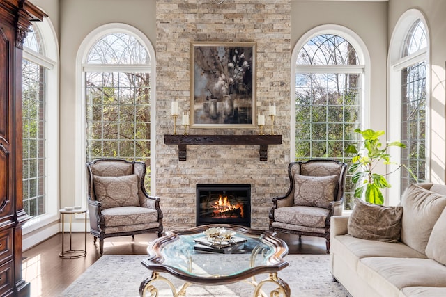 sunroom with a fireplace and a wealth of natural light