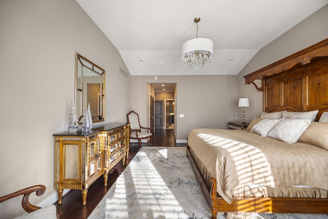 bedroom with dark hardwood / wood-style floors, an inviting chandelier, and lofted ceiling