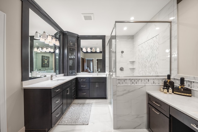 bathroom with tile walls, vanity, and an enclosed shower