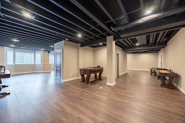 basement featuring dark hardwood / wood-style flooring