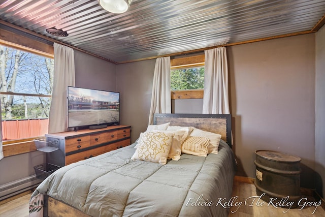 bedroom with light hardwood / wood-style floors