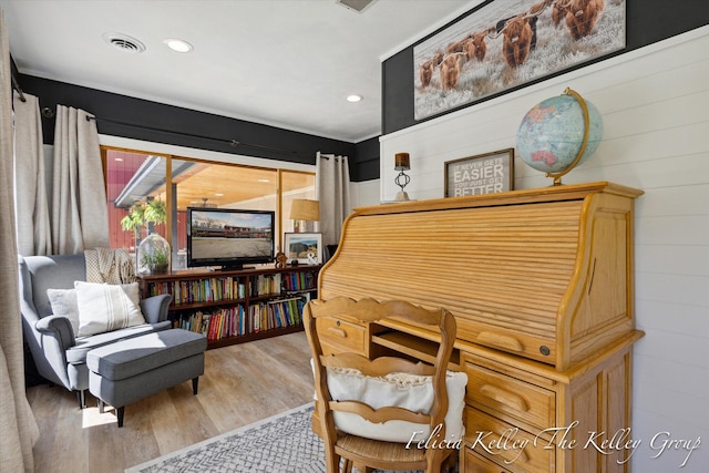 sitting room with hardwood / wood-style floors