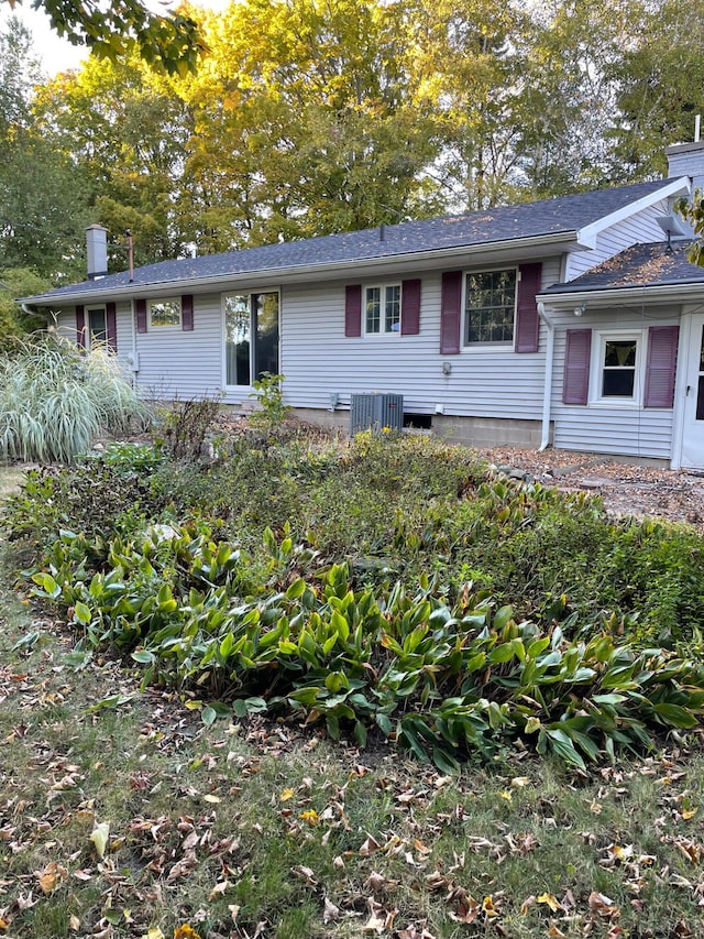 ranch-style house featuring central air condition unit