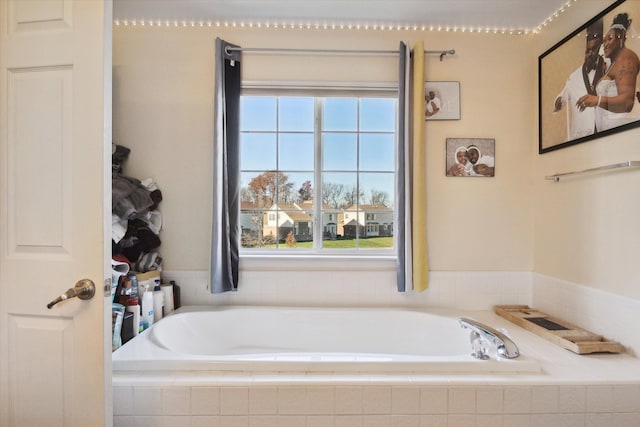 bathroom with tiled tub