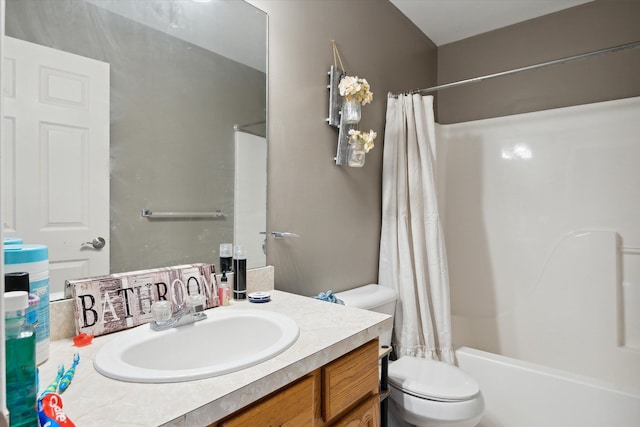 full bathroom with vanity, toilet, and shower / bath combo with shower curtain