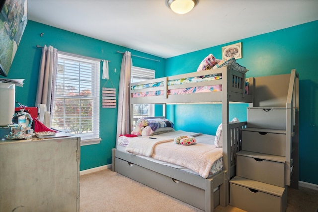 bedroom featuring light colored carpet