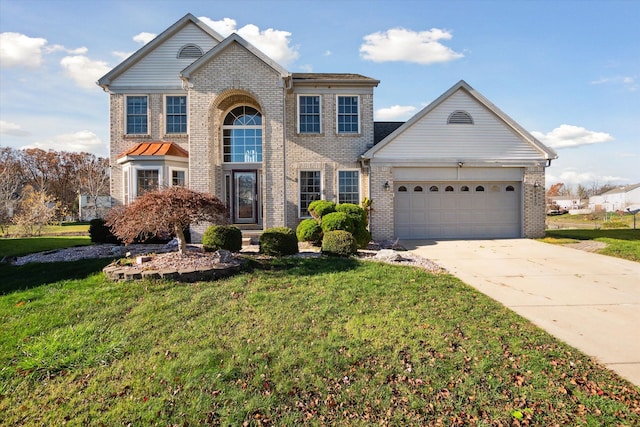 view of property with a front yard and a garage