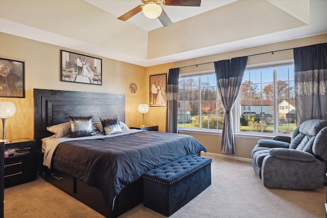 bedroom featuring ceiling fan and carpet