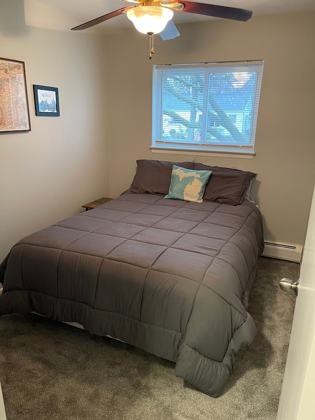 carpeted bedroom with a baseboard radiator and ceiling fan