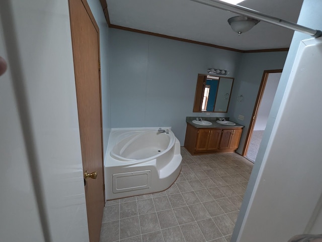 bathroom featuring a tub, crown molding, and vanity