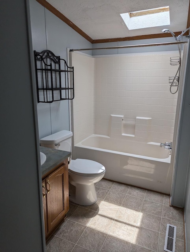 full bathroom featuring a skylight, ornamental molding, vanity, a textured ceiling, and shower / tub combination