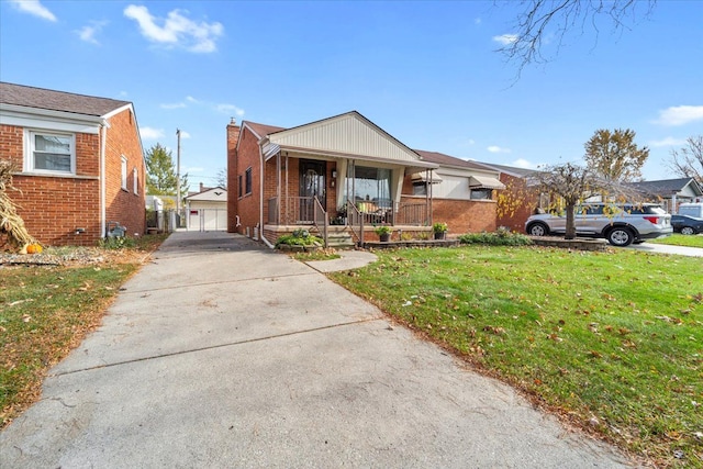 view of front of property featuring an outbuilding, a porch, a garage, and a front yard