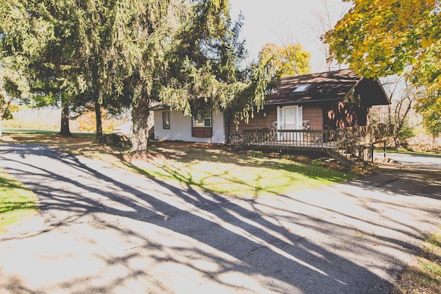 view of front of home with a wooden deck