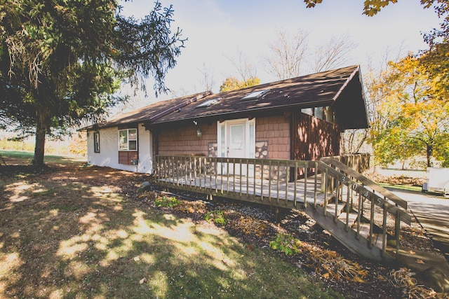 view of front of house with a wooden deck