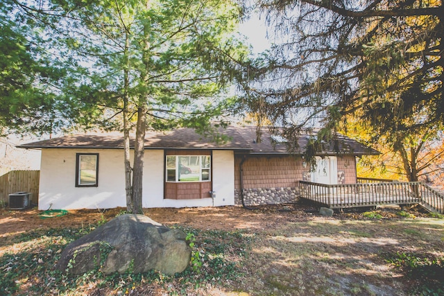 exterior space featuring a wooden deck and central AC unit