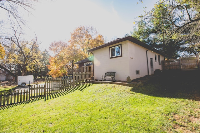 view of home's exterior featuring a yard