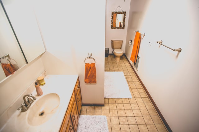 bathroom featuring tile patterned floors, vanity, and toilet