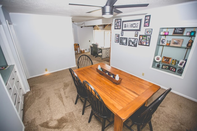 carpeted dining area with ceiling fan and a textured ceiling