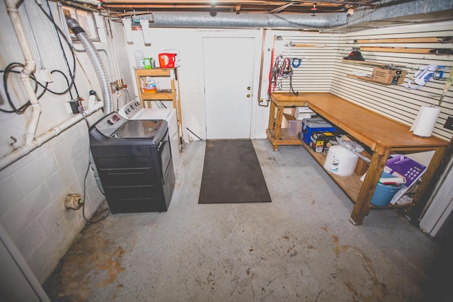 basement with independent washer and dryer and a workshop area