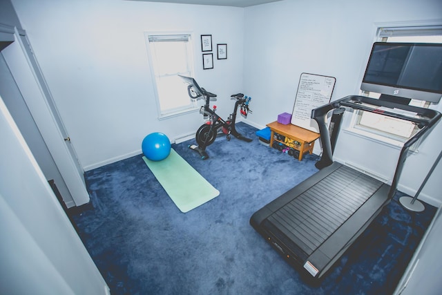 workout room with dark carpet