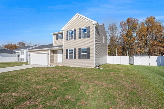 view of front of property with a garage and a front lawn