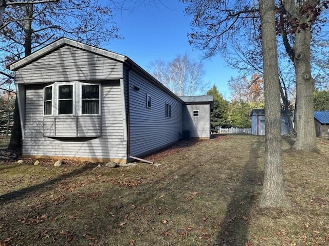 view of property exterior with a shed