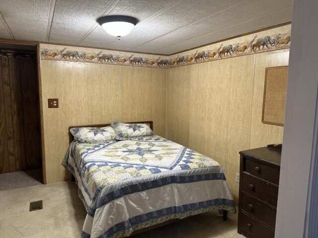 2965 Pointe Aux Barques Rd, Port Austin, MI 48467 - bedroom with carpet and wooden walls