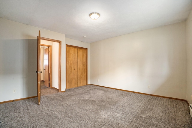 unfurnished bedroom with carpet flooring and a closet