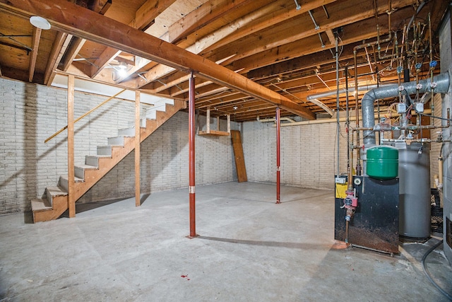 basement featuring brick wall