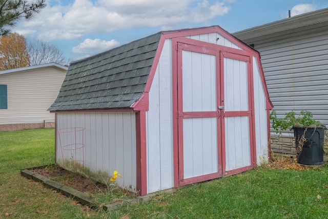 view of outdoor structure with a lawn