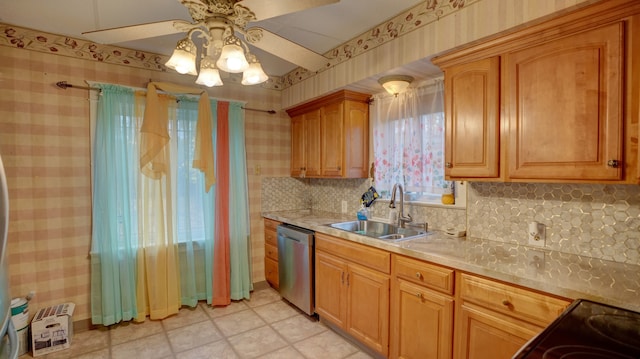 kitchen with tasteful backsplash, dishwasher, sink, and ceiling fan