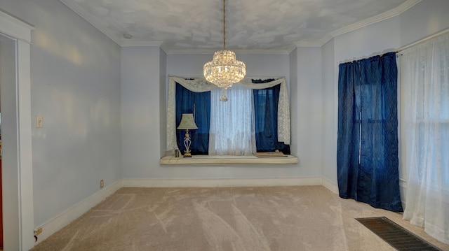 carpeted empty room featuring visible vents, baseboards, an inviting chandelier, and ornamental molding