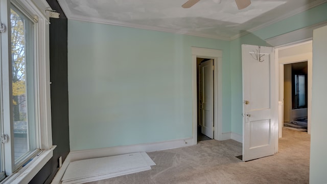 1644 Mason St, Flint, MI 48503 - unfurnished bedroom with carpet floors, crown molding, baseboards, and ceiling fan