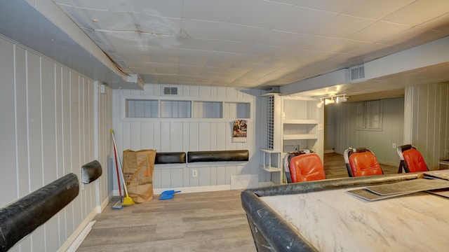 1644 Mason St, Flint, MI 48503 - recreation room featuring wood finished floors, baseboards, and wood walls