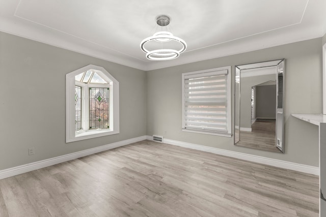 unfurnished dining area with light hardwood / wood-style floors