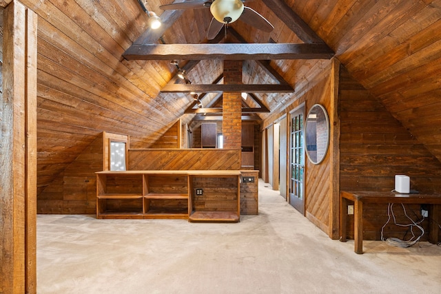 bonus room with vaulted ceiling with beams, wooden walls, and carpet