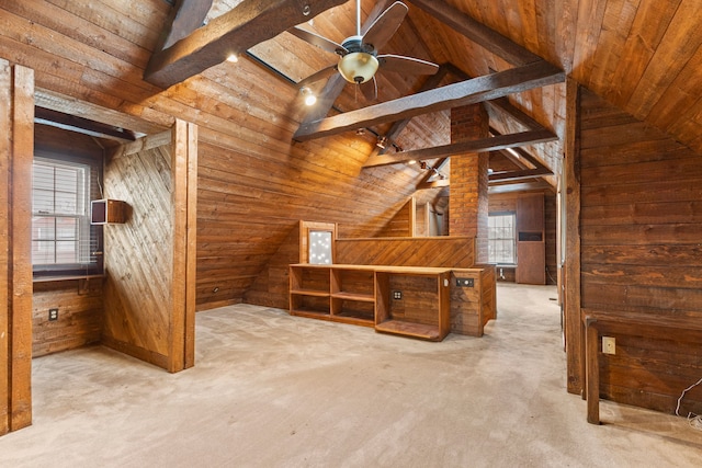 bonus room featuring ceiling fan, wood ceiling, light carpet, and wooden walls