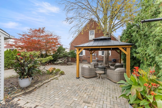 view of patio featuring a gazebo and an outdoor hangout area