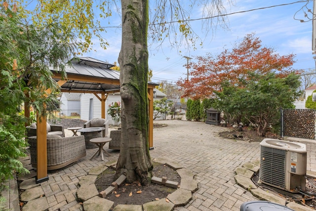 view of patio / terrace with a gazebo and cooling unit