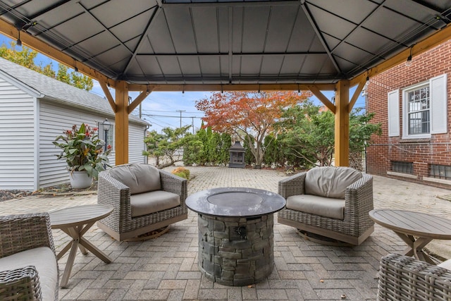 view of patio with a gazebo and a fire pit