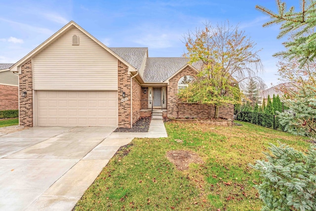 view of front of property featuring a garage and a front lawn