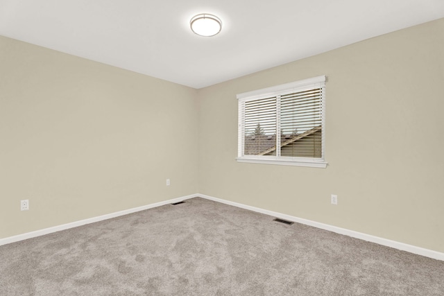 empty room featuring carpet floors