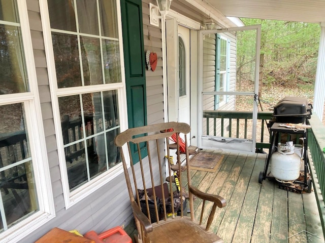 wooden terrace featuring grilling area